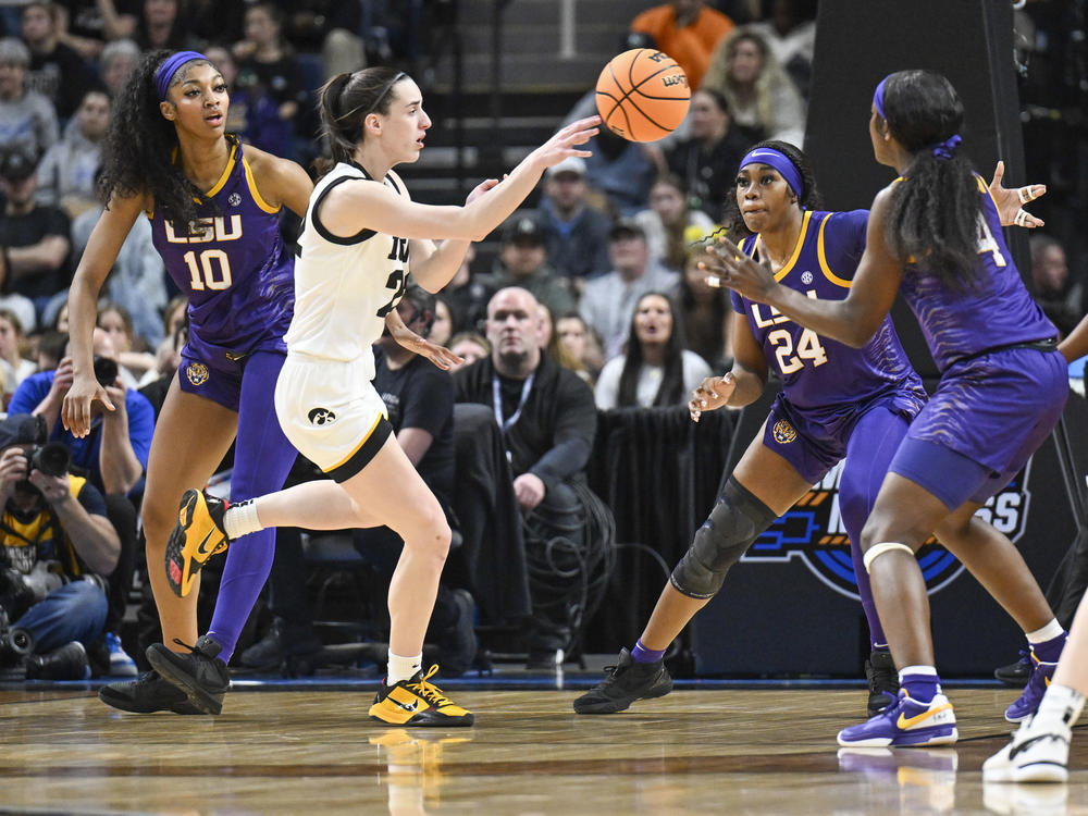LSU's Angel Reese, left, and Iowa guard Caitlin Clark, center, called their Elite Eight game a great event for their sport. Millions of viewers agreed, launching the contest to the top of ESPN's ratings.