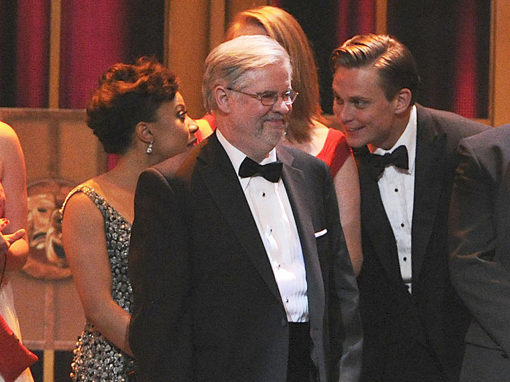 Playwright Christopher Durang appears on stage with producers to accept the award for best play for 