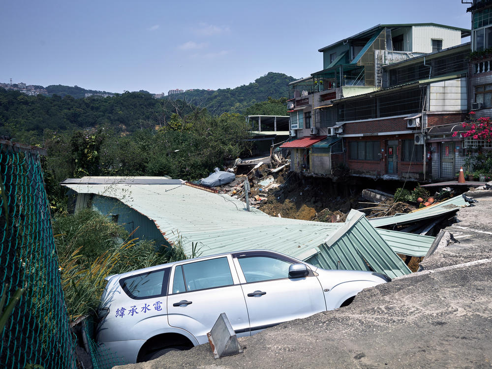 New Taipei City: A vehicle in a collapsed road following an earthquake
