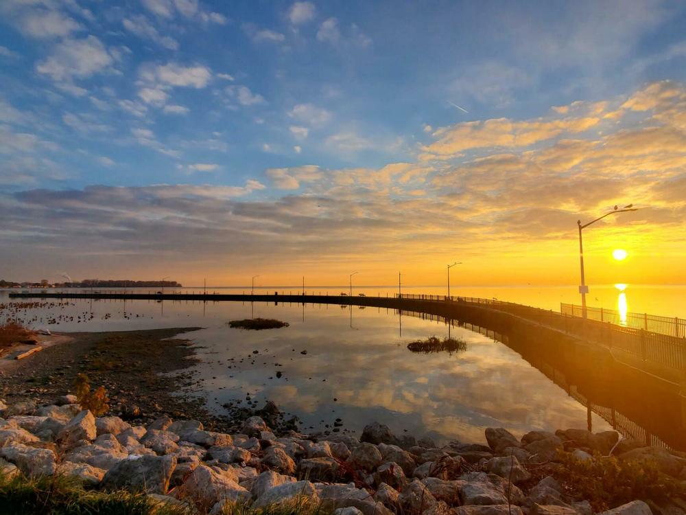A view of the sunrise over Lake Erie in Luna Pier in November 2021. It's one of few places in the path of totality in Michigan.