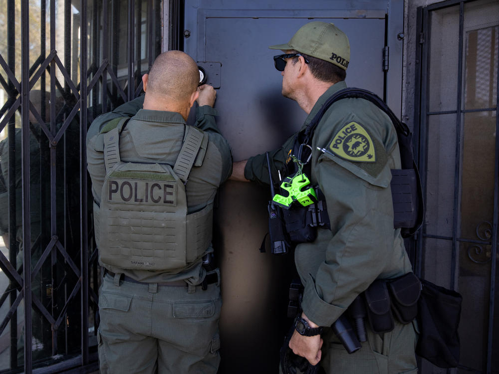 California Department of Cannabis Control detectives lock the premises after serving a search warrant on an unlicensed dispensary in Long Beach, Calif., on March 5, 2024. The penalty for unlicensed cannabis sales is usually a fine.