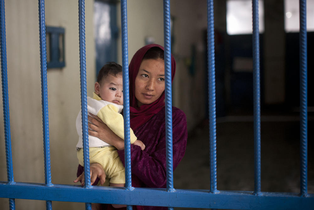An Afghan female prisoner, Nuria, with her infant boy at Badam Bagh, Afghanistan's central women's prison, in Kabul, March 28, 2013.