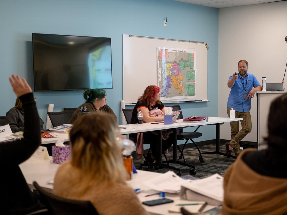 Instructor John Shryock conducts a training session at Denver 911.