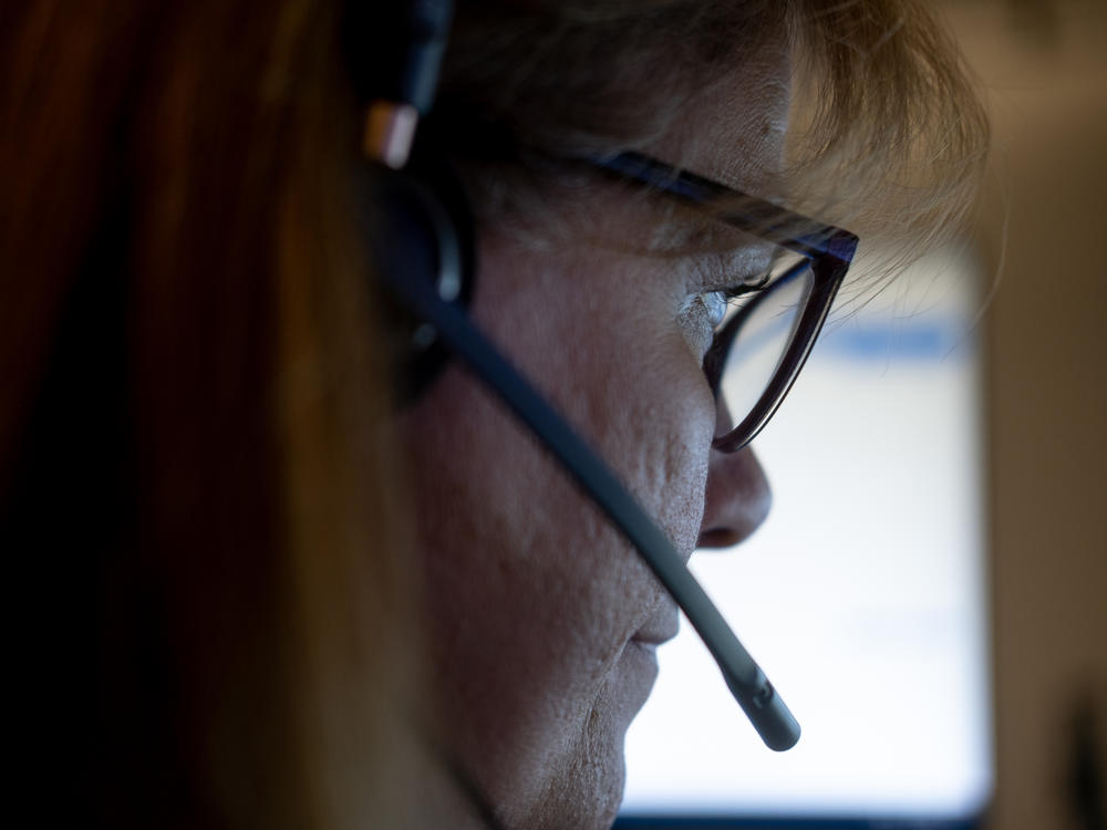 Linda Anderson, an emergency communications technician, during a call at the Denver 911 dispatch center.