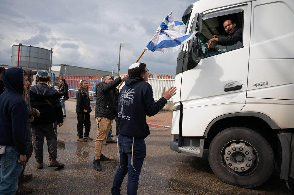 Israeli right wing activists block the entrance to the port in Ashdod, Israel on Feb. 1, 2024, during a protest meant to prevent trucks with humanitarian aid destined for the Gaza Strip.