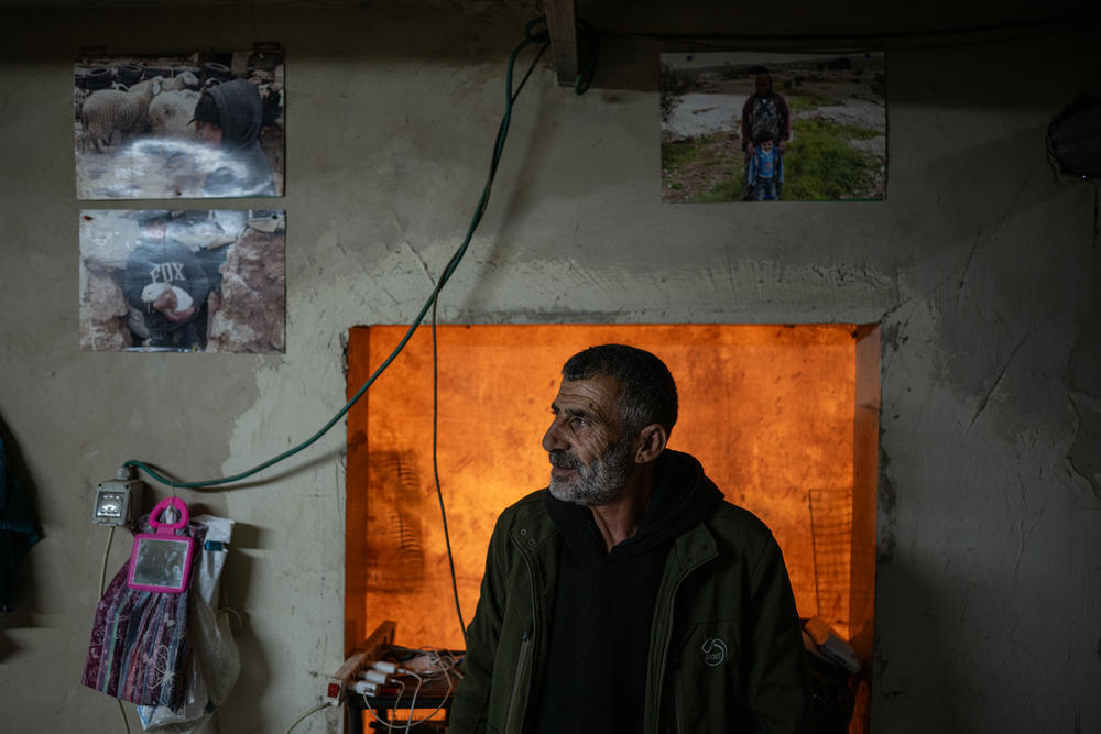 Azzam Nuwaja, a Palestinian farmer, stands in his home in Susya in the occupied West Bank on Feb. 19.