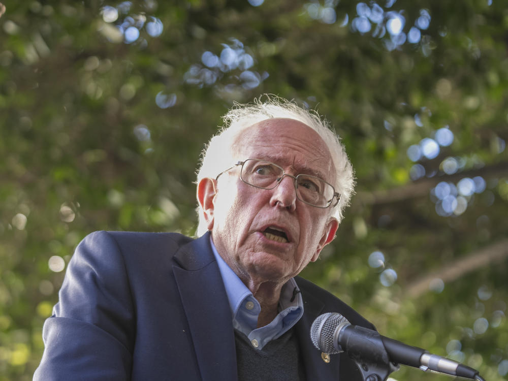 Sen. Bernie Sanders addresses Unite Here Local 11 workers protesting outside of Figueroa Hotel in downtown Los Angeles on Friday. Authorities charged a man with setting a fire at his Burlington, Vt., office that same day.