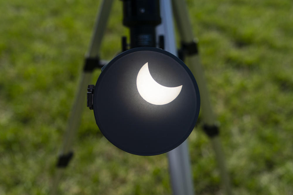 A telescope projects the solar eclipse on a filter on Monday, April 8, 2024, at the Ste. Genevieve County Community Center in Ste. Genevieve.