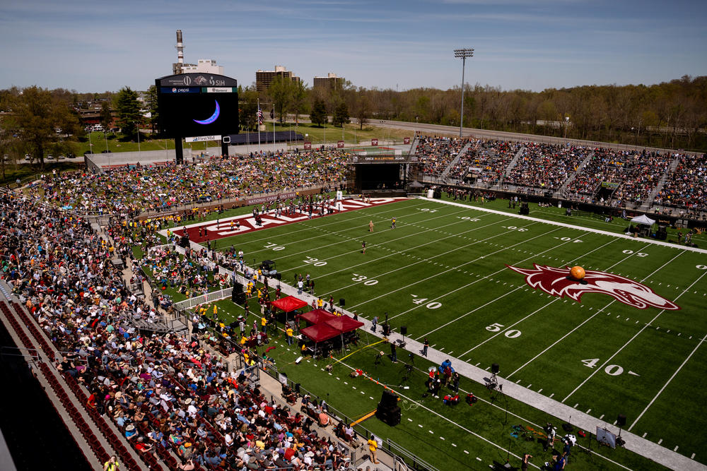 Thousands pack into Saluki Stadium to watch the total solar eclipse in Carbondale, Ill.