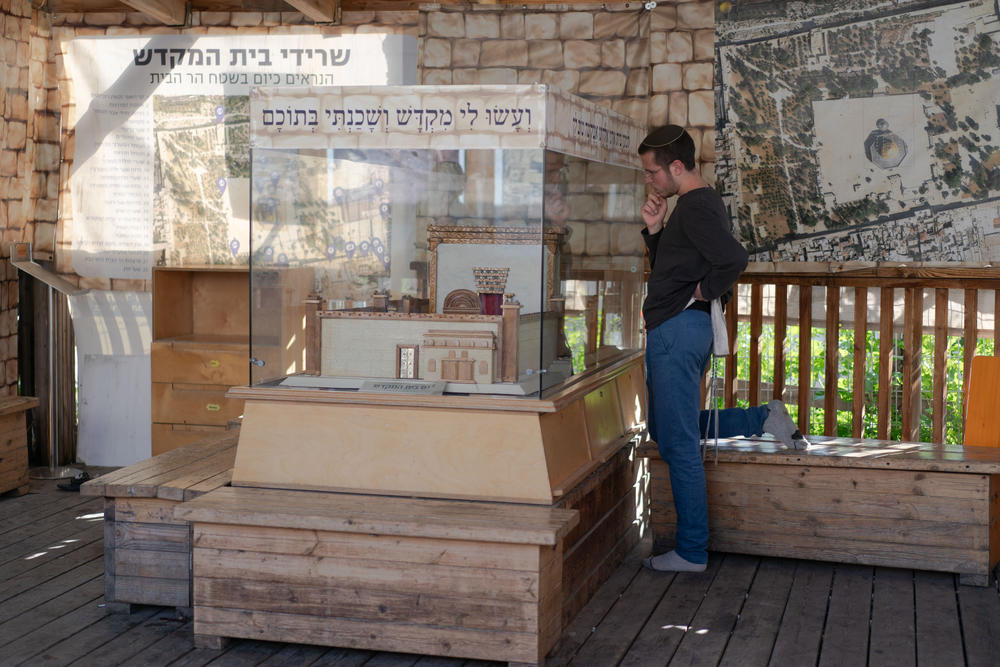 A Jewish man looks at a model of what the Temple Mount would have looked like before destruction on his way into the Al-Aqsa compound on March 21.