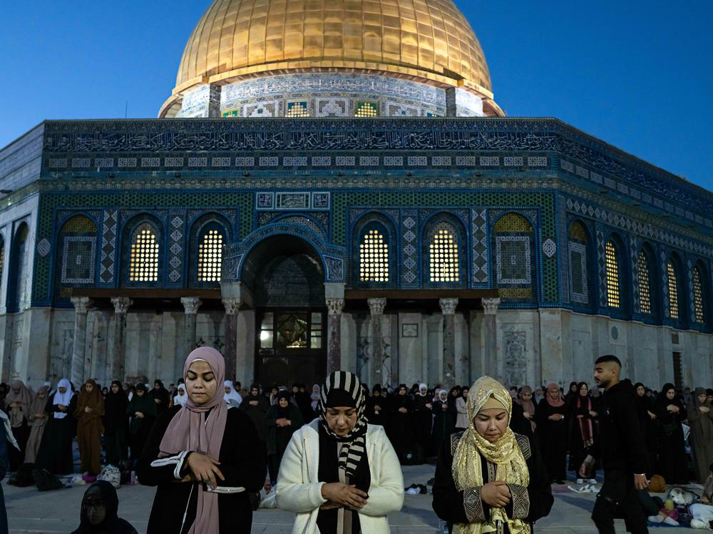 Palestinian women pray outside the Dome of the Rock in East Jerusalem during the Muslim holy month of Ramadan, on April 3.