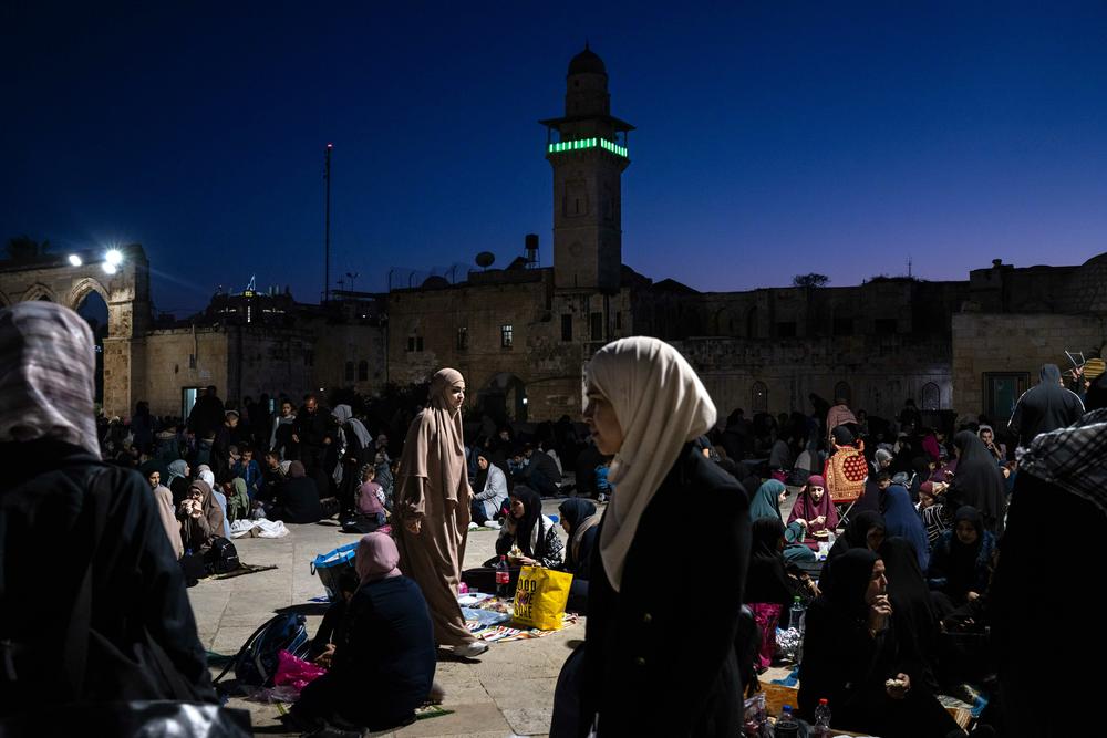 Muslim worshippers and Palestinian families break their fast during Ramadan at the Dome of the Rock and Al-Aqsa Mosque compound in East Jerusalem, on April 3.