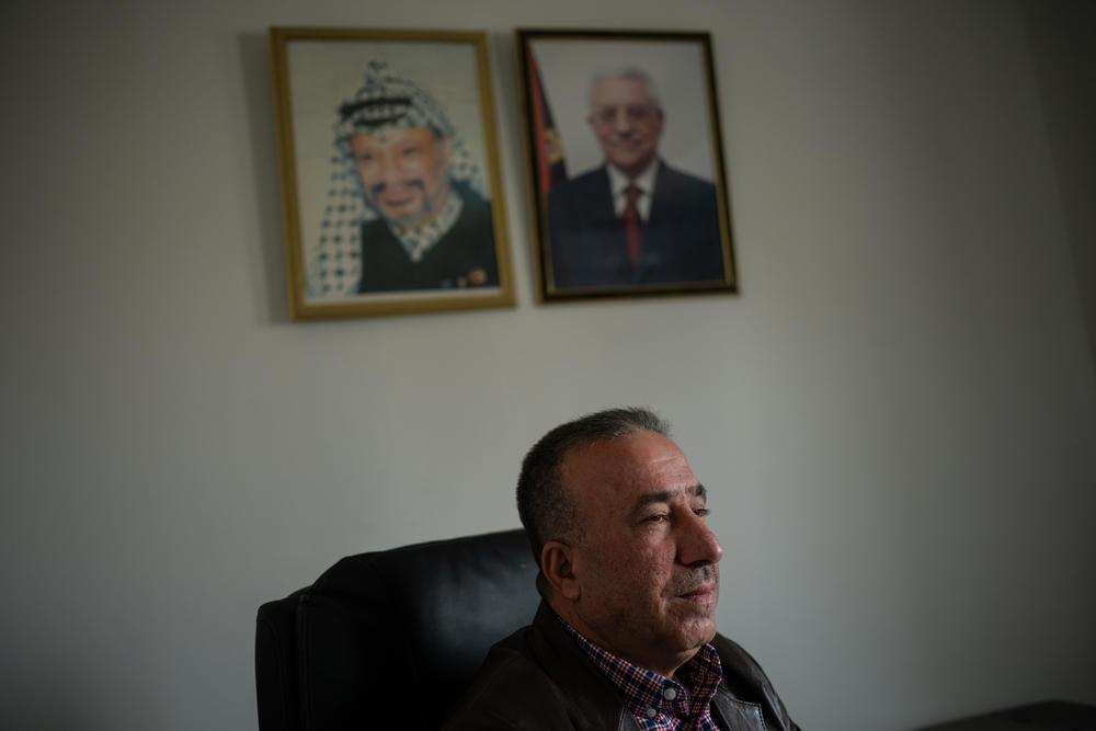 Azmi Abdel Rahman, director of policy with the Palestinian Ministry of Labor, sits for a portrait in his office in Ramallah in the occupied West Bank, on March 24.