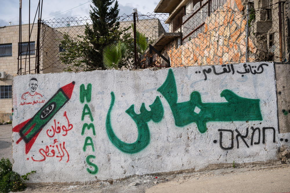 Graffiti on a building in the Palestinian village of Kafr Ni'ma in the occupied West Bank on March 24.