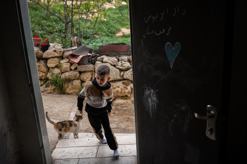 Anas Zeita, 5, enters his family's home in the Palestinian village of Ein 'Arik in the occupied West Bank on March 24.