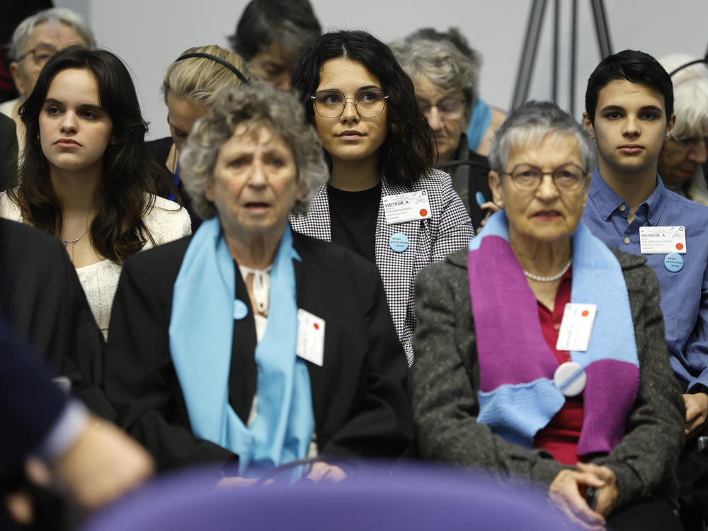 Portugal's Catarina dos Santos Mota, center, attends the session at the European Court of Human Rights Tuesday, April 9, 2024 in Strasbourg, eastern France.