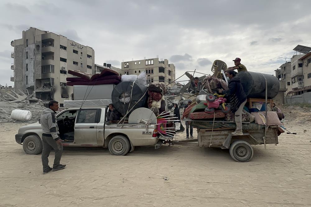 Palestinians displaced from Khan Younis returned after Israel's withdrawal to salvage belongings from their homes.