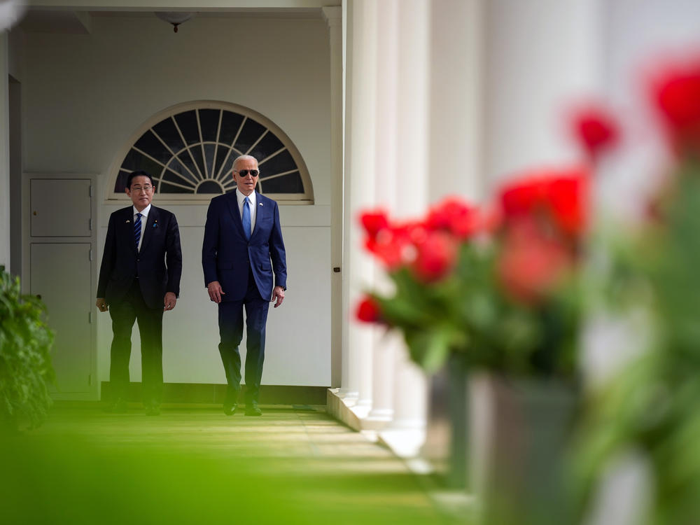 President Biden and Japanese Prime Minister Fumio Kishida walk on the colonnade as they make their way to a meeting in the Oval Office at the White House.