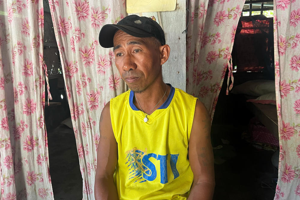Fisherman Larry Hugo, 45, in his home on Thitu Island, which the Philippines calls Pag-asa.