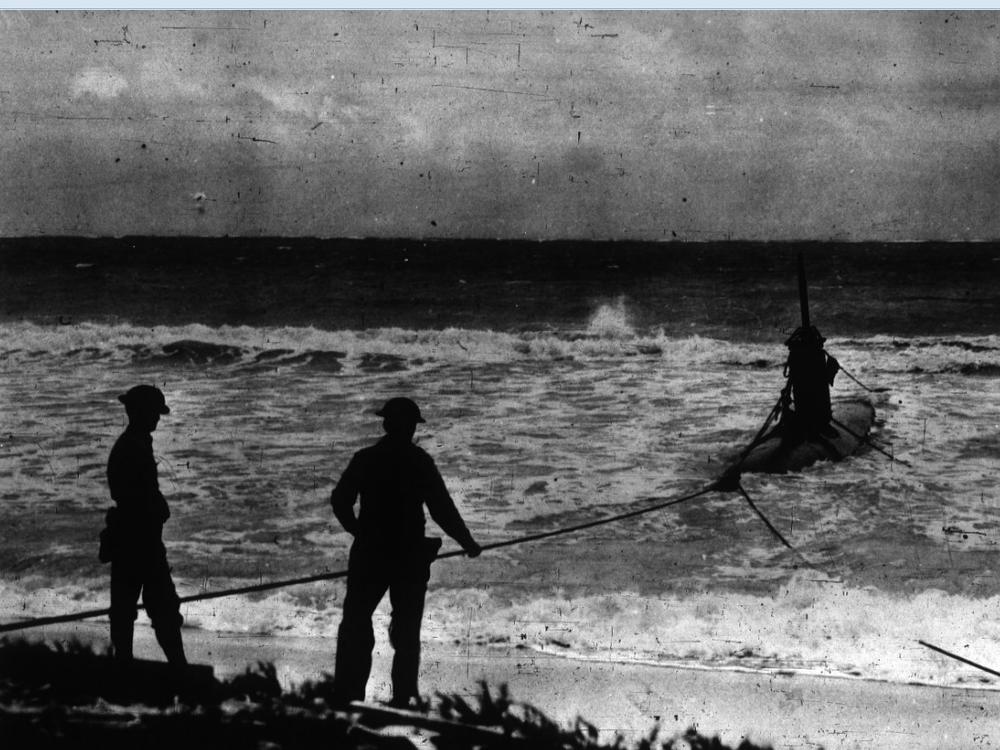 An American hauls in a HA-19 Japanese submarine following the attack on Pearl Harbor in 1941. Submarine warfare would prove crucial during WWII.
