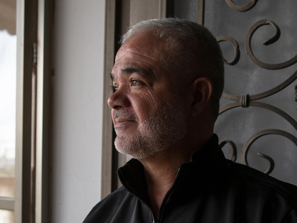 Pastry maker Rafe' Rummaneh, shown here in his home outside Ramallah in the occupied West Bank on April 9, is only making a few treats for friends this Eid.