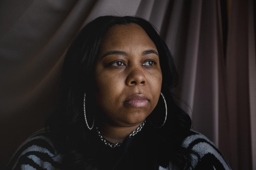 Rashana Greer, 42, sits for a portrait at her childhood home in Philadelphia on Monday, March 25, 2024. Greer lost a nephew in 2020 to gun violence. She decided to move her family out of state because she was afraid of how many homicides there were in Philadelphia.