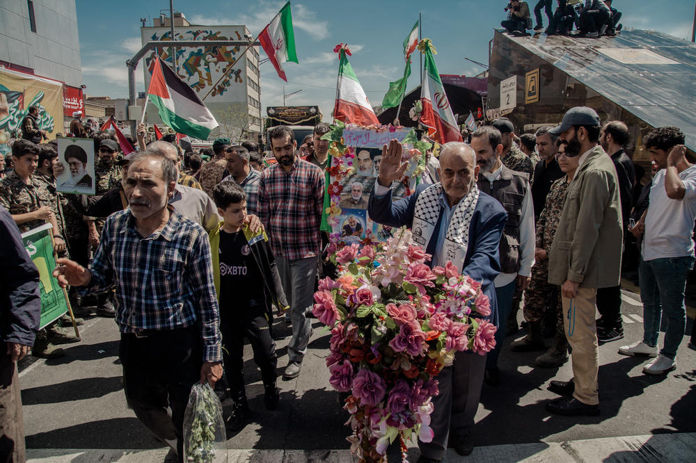 People attend the funeral procession for seven Islamic Revolutionary Guard Corps members killed in a strike in Syria, which Iran blamed on Israel, in Tehran, April 5.