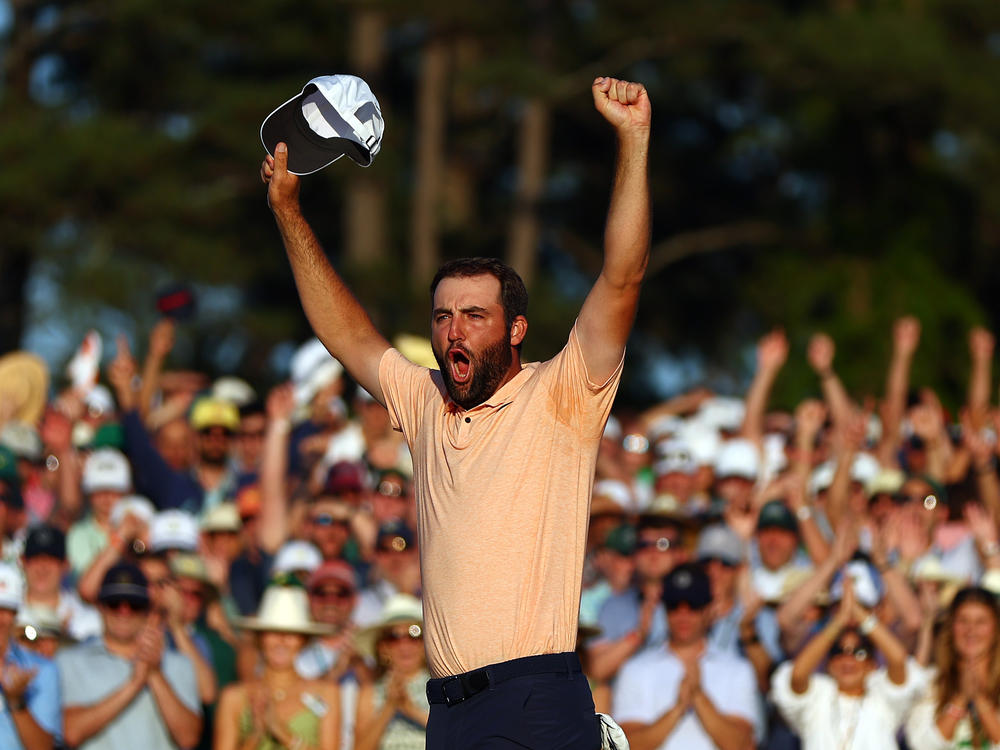 Scottie Scheffler celebrates on the 18th green after winning the 2024 Masters Tournament at Augusta National Golf Club on Sunday in Augusta, Ga.