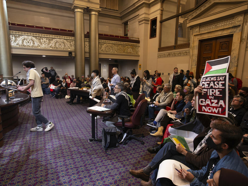 Audience members listen to public comment at a special session of the Oakland City Council about a resolution calling for an immediate cease-fire in Gaza on Nov. 27, 2023, in Oakland, Calif.