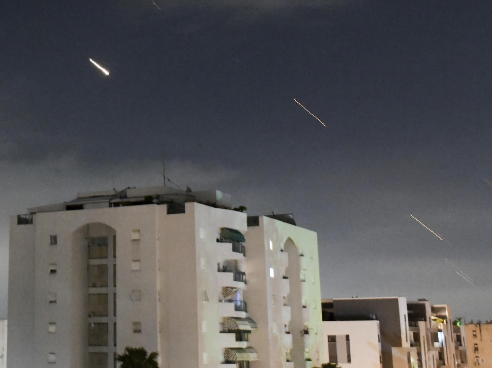 Israeli Iron Dome air defense system launches to intercept missiles fired from Iran, in central Israel, Sunday, April 14, 2024.