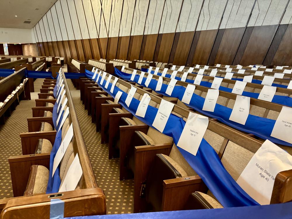 At Sinai Temple in west Los Angeles, blue ribbon marks off more than 130 seats that stand as reminders of the hostages who remain in Gaza following the Oct. 7 attack on Israel