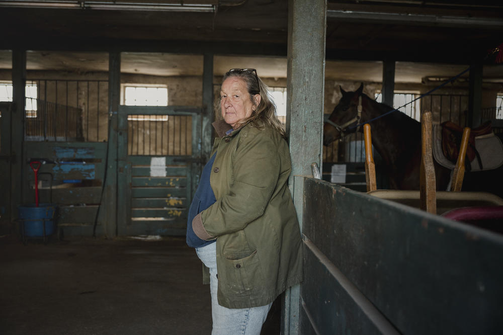 Lezlie Hiner, owner and founder of Work to Ride, stands for a portrait at the Northwestern Stables in Philadelphia, Pa., on March 30, 2024.