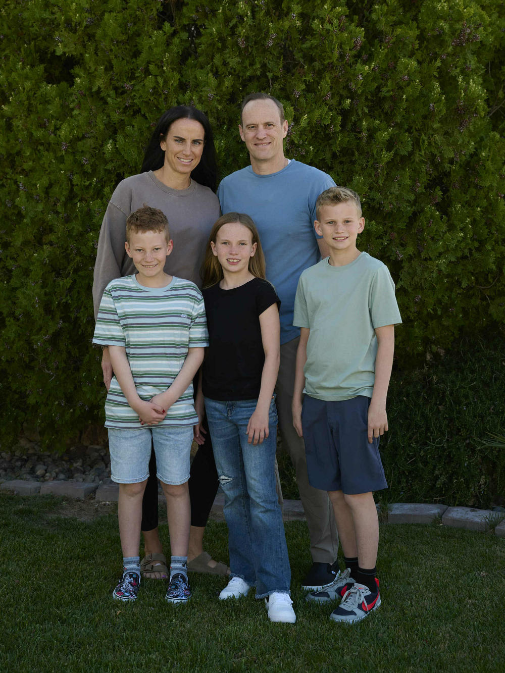 Members of the Hall family pose for a photo at their Las Vegas home: parents Hillary and Jeff and children Winston (from left), Maggie and Walker.