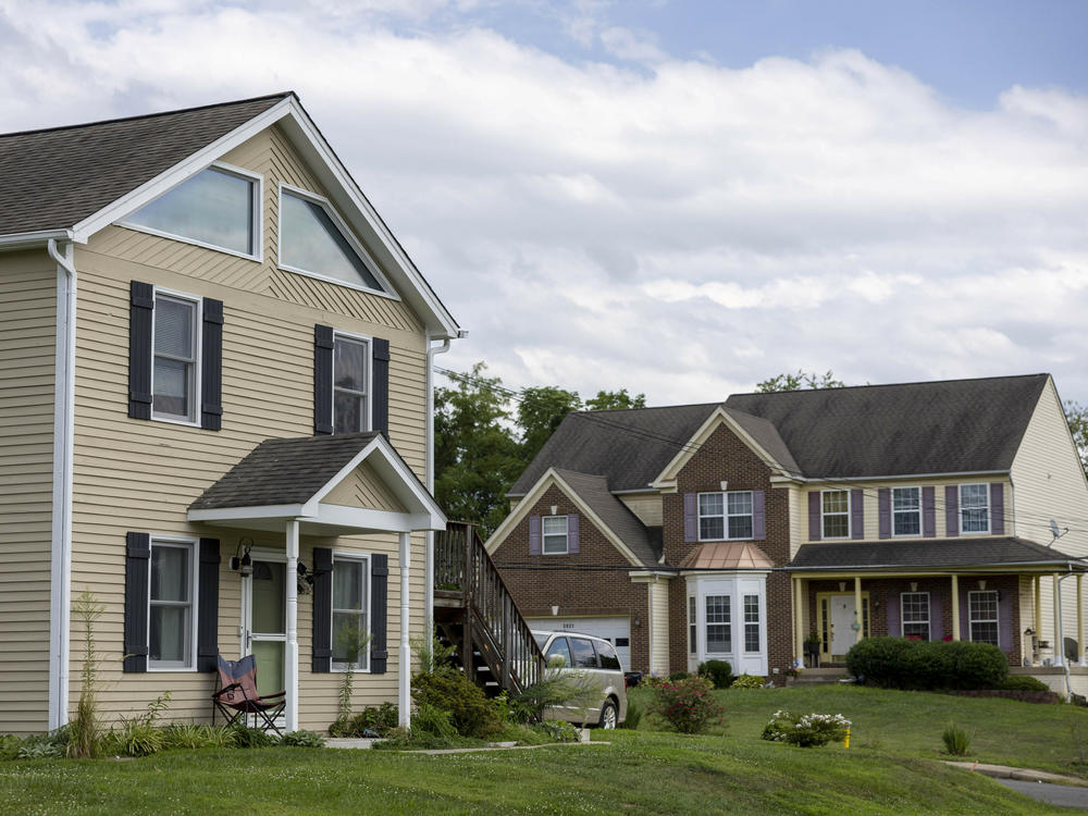 Some baby boomers would like to downsize from their large homes, but say it doesn't make financial sense. Single-family homes in Dumfries, Va., are seen here last year.
