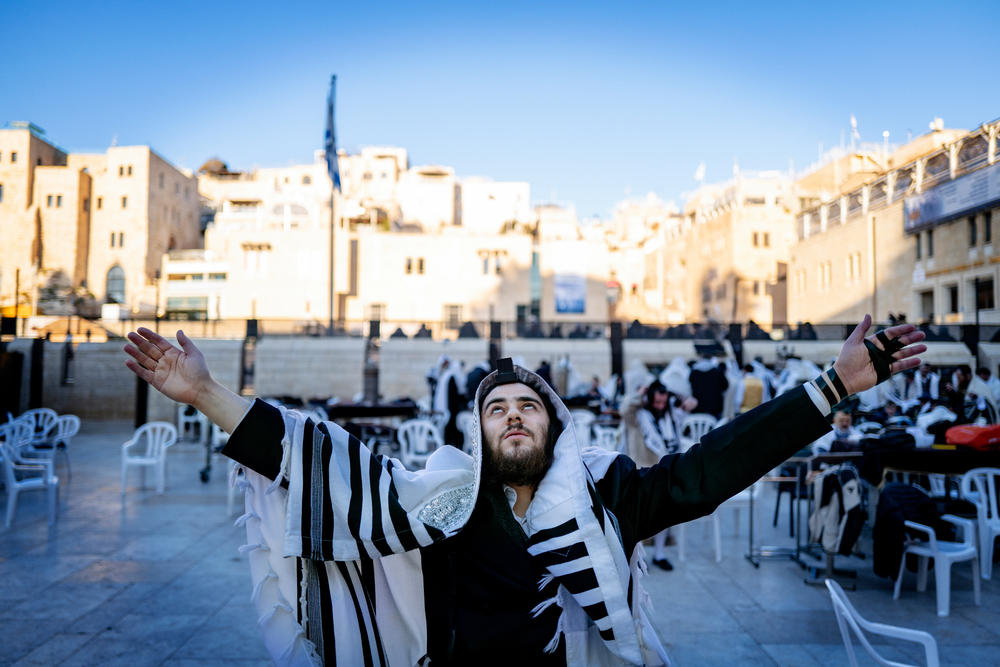 An Orthodox Jew prays at the Western Wall in Jerusalem's Old City on March 25. Above the Western Wall is the compound revered by Muslims as the Noble Sanctuary and by Jews as the Temple Mount.