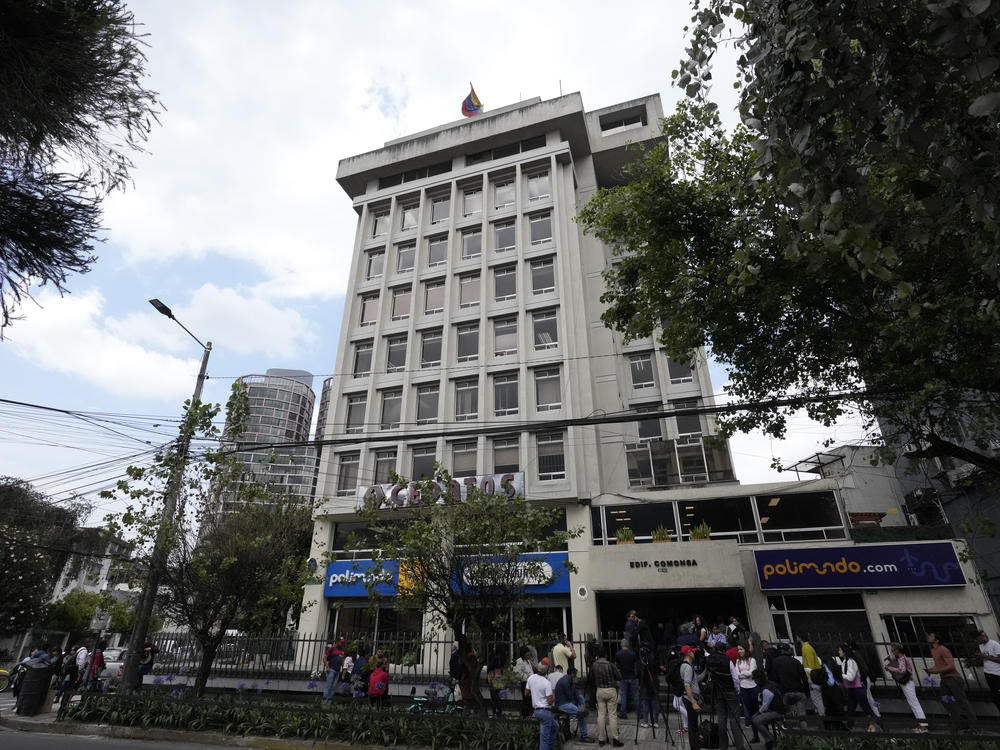 People stand outside the Venezuelan embassy in Quito, Ecuador, on Tuesday.