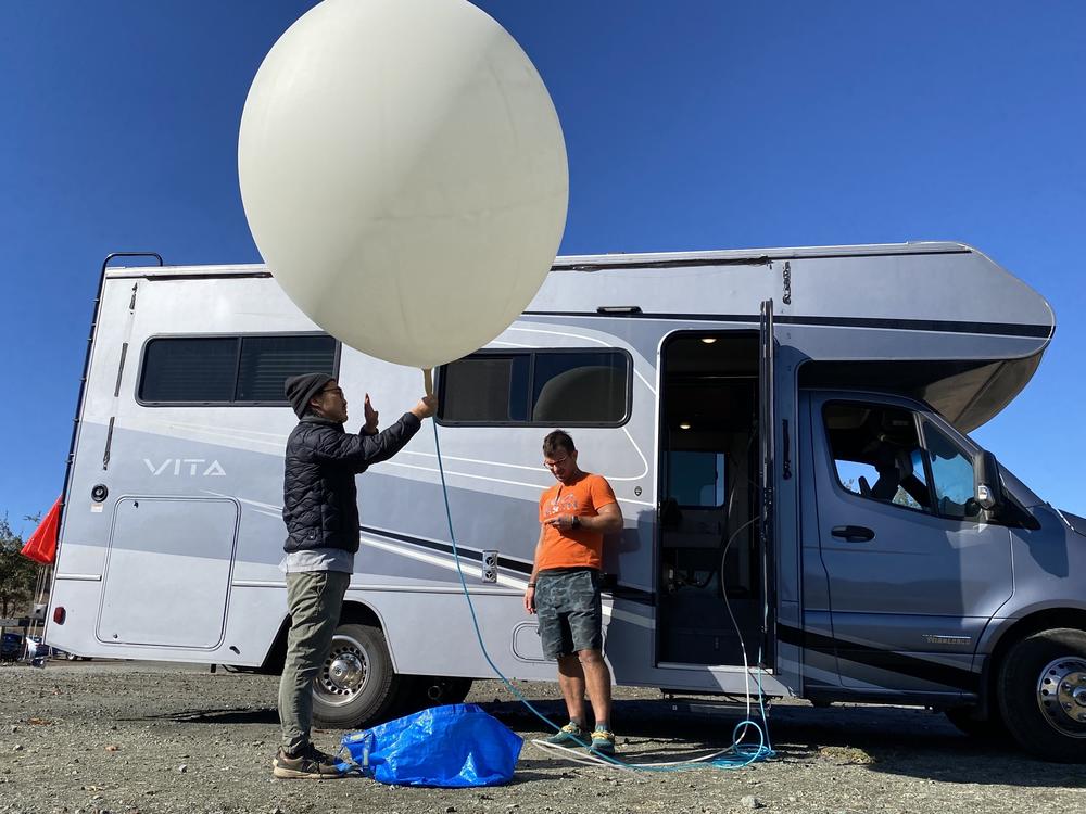 Andrew Song and Luke Iseman of Make Sunsets ready for a launch. Iseman says they hope to someday cool the earth on a larger scale.