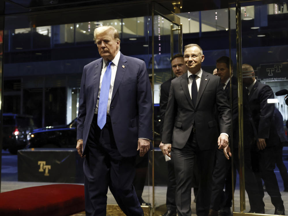 Republican presidential candidate former President Donald Trump walks with Poland's President Andrzej Duda at Trump Tower in midtown Manhattan in New York on Wednesday, April 17, 2024.