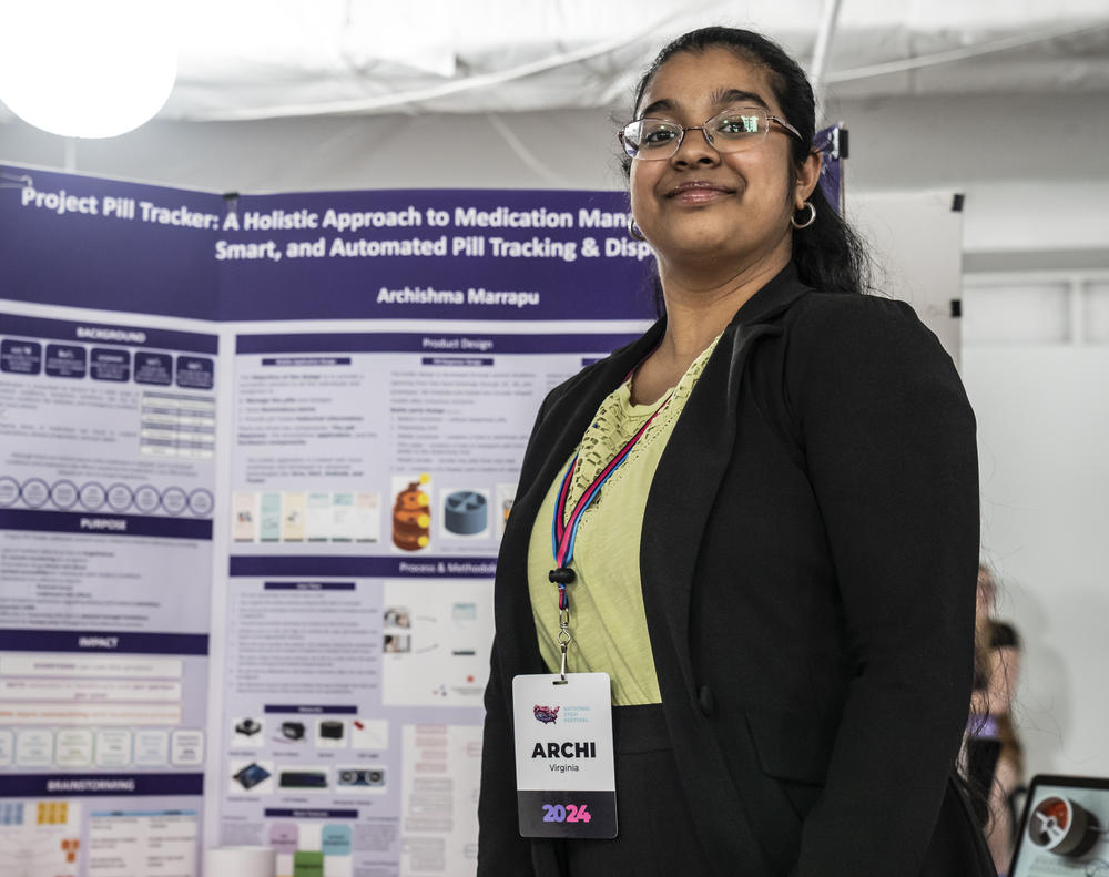 Archi Marrapu, 17, excitedly tells visitors about her project. 