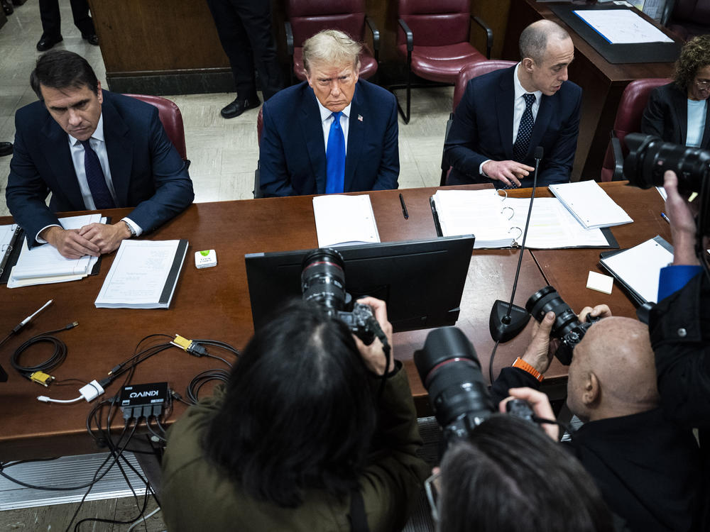 Former President Donald Trump, flanked by attorneys Todd Blanche (left) and Emil Bove (right), arrives for his criminal trial as jury selection continues at Manhattan court on Thursday.