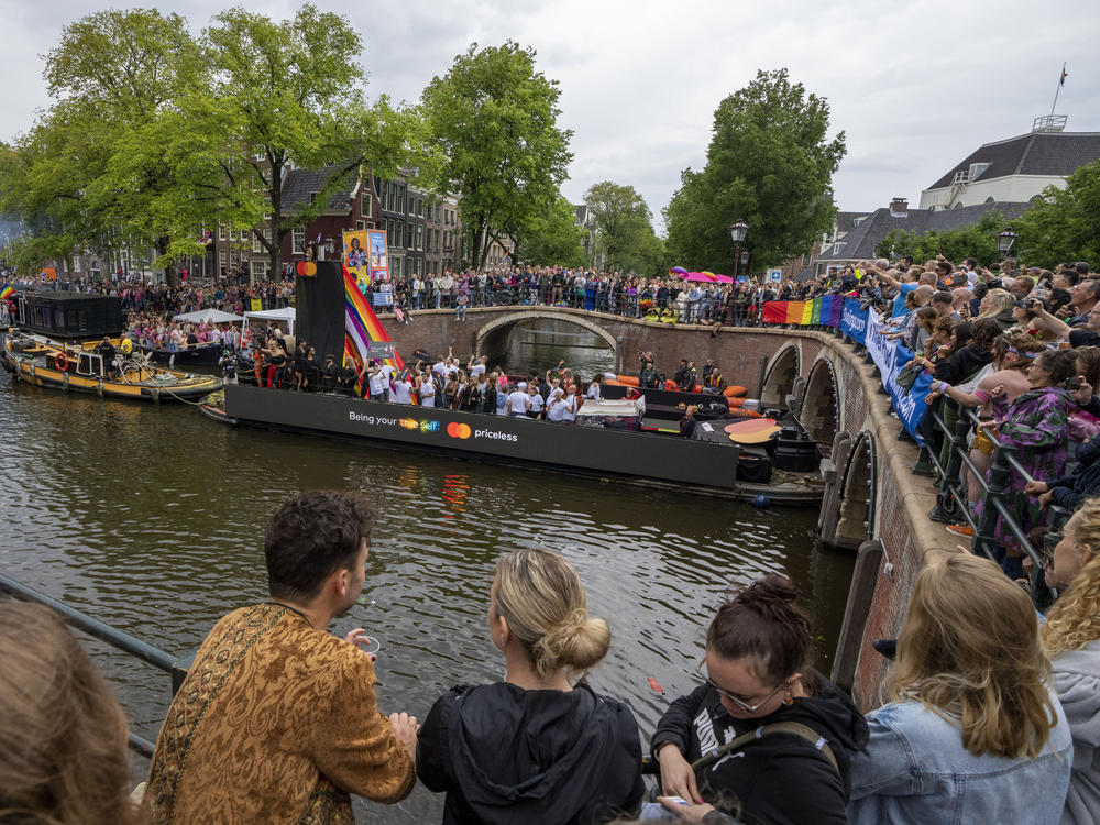 Tens of thousands of people watched as dozens of colorfully decorated boats toured the Dutch capital's historic canals Saturday, Aug. 5, 2023, in the most popular event of a six-day Pride Amsterdam festival that attracts tens of thousands of visitors to the city.