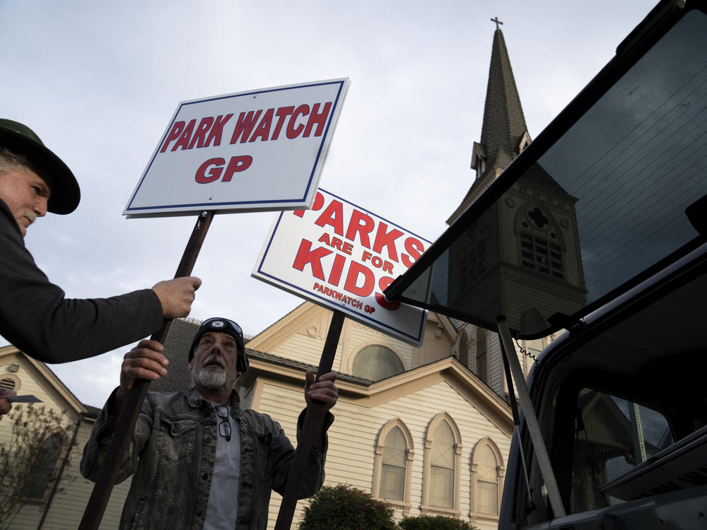 Demonstrators rally outside City Hall in Grants Pass, Ore., on March 20. The self-proclaimed 