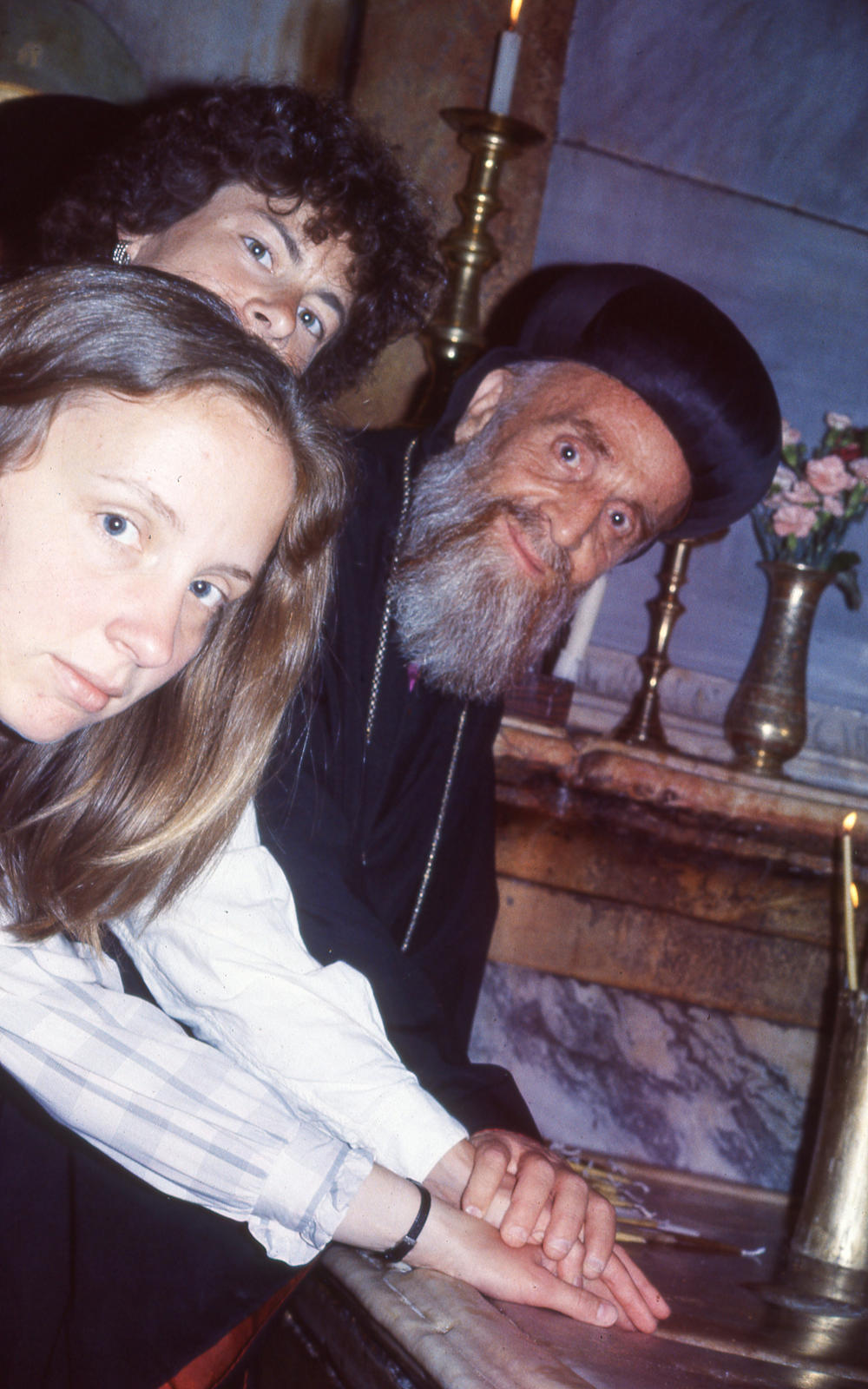 At the Church of the Holy Sepulchre, Archbishop Jajjawi offered to perform an ancient ritual that would join Darling Young, left, and Harvey as sisters.