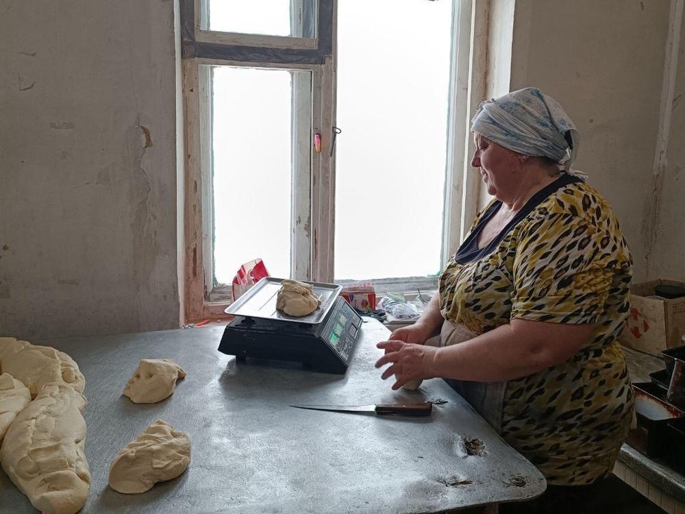 A baker at work in the community bakery run by Ihor Yershov, a pastor, and his wife, Yevheniia Yershova, near the war's front line. They make and give away 1,000 loaves of bread a day.