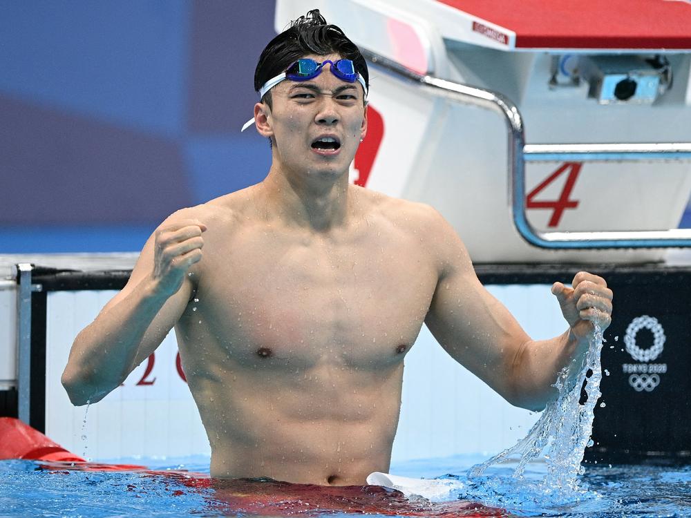 China's Wang Shun celebrates after winning gold in the final of the men's 200m individual medley swimming event during the Tokyo Olympic Games on July 30, 2021. His name is on a list of athletes who allegedly tested positive for a performance enhancing drug.