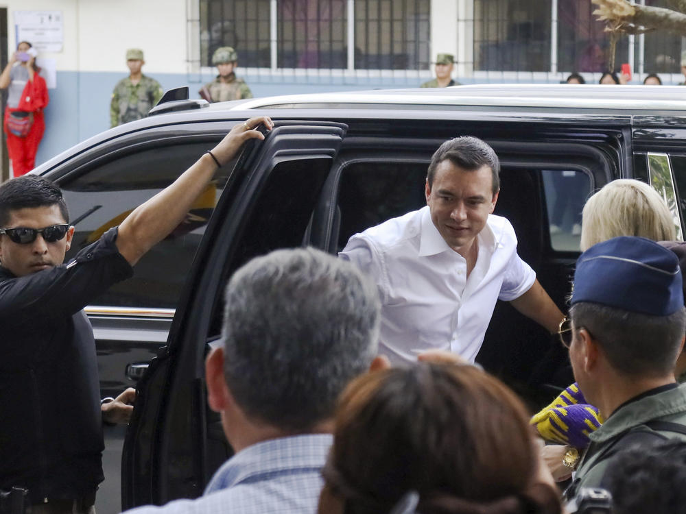 President Daniel Noboa arrives to vote in a referendum to endorse new security measures to crackdown on criminal gangs responsible for increasing violence, in Olon, Ecuador, Sunday, April 21, 2024.