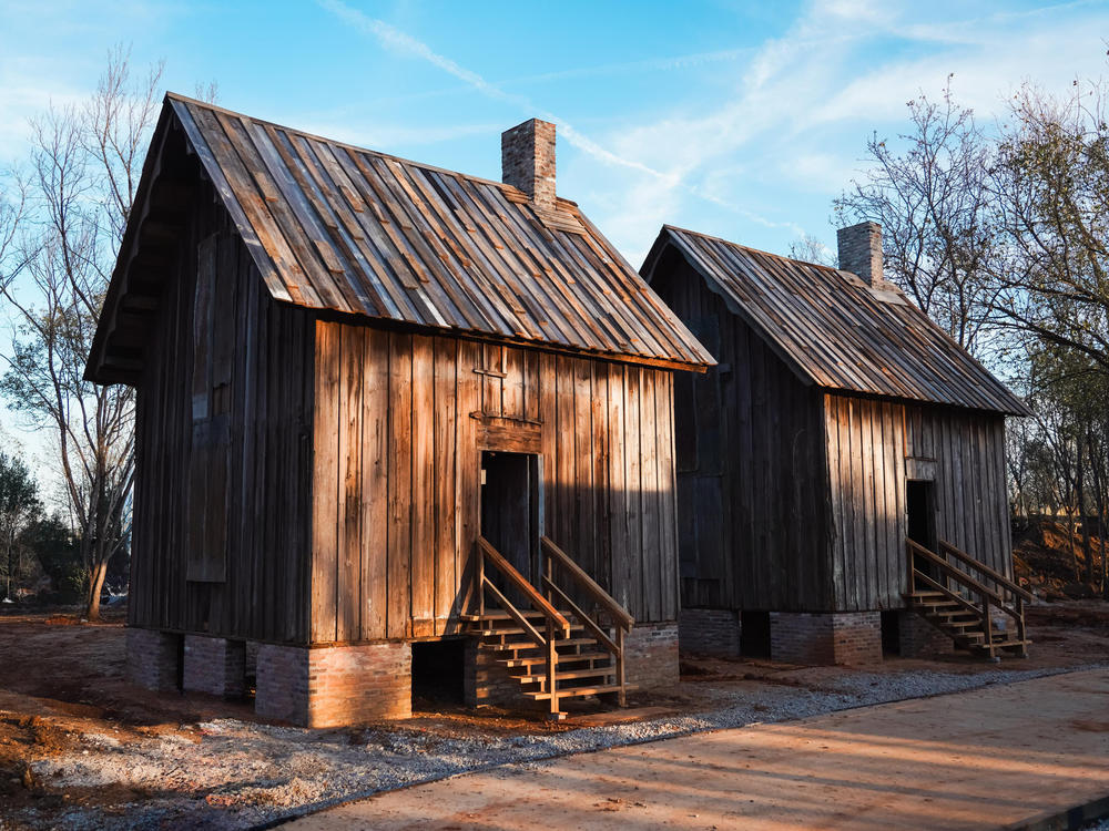 Structures in the Freedom Monument Sclupture park give a sense of the homes enslaved individuals lived in.
