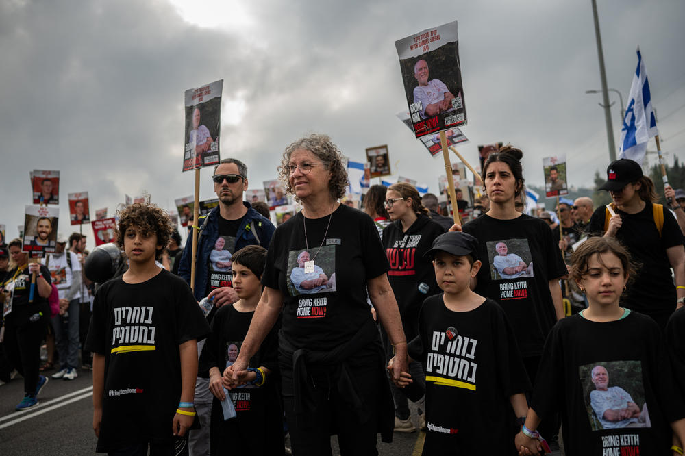 Aviva Siegel, her grandchildren and other relatives walk together at the front of a march supporting the hostage families as they approach their destination, Jerusalem, on March 2. The four-day march by hostage families and their supporters began in the areas attacked on Oct. 7 in southern Israel, and grew to 15,000 people at its peak.