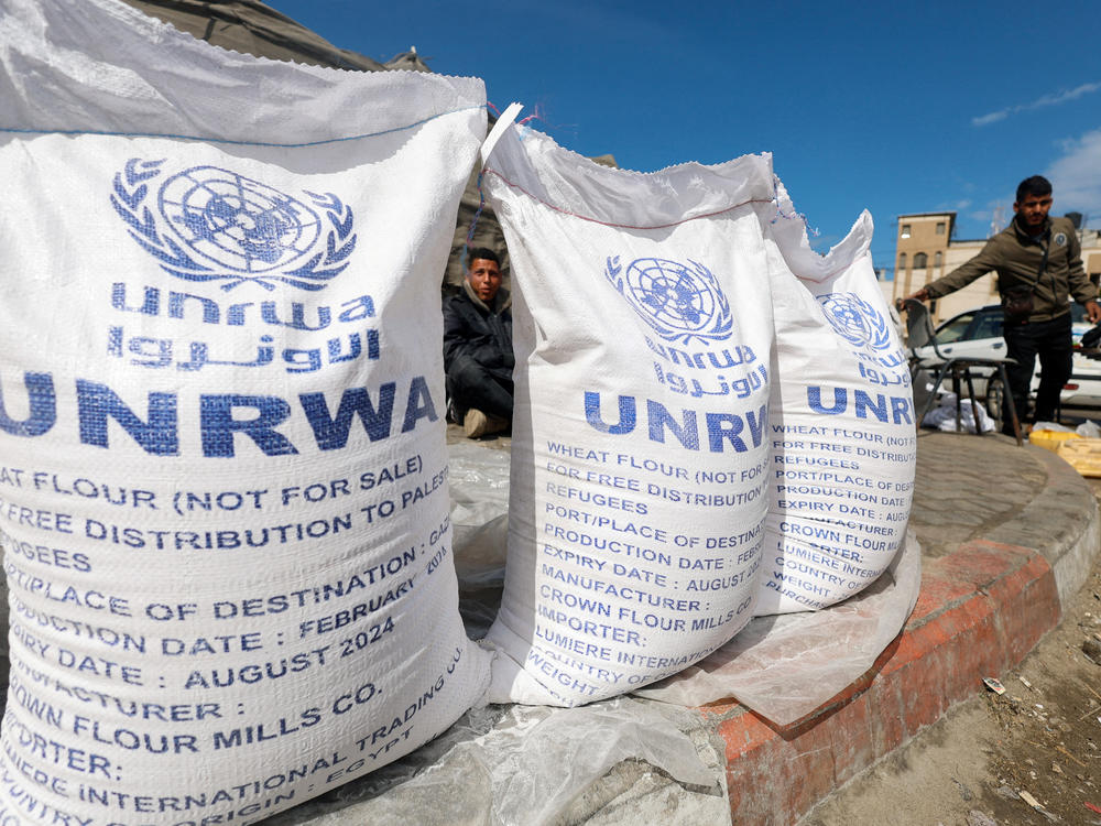 Displaced Palestinians wait to receive UNRWA aid in Rafah, in the southern Gaza Strip, March 7.