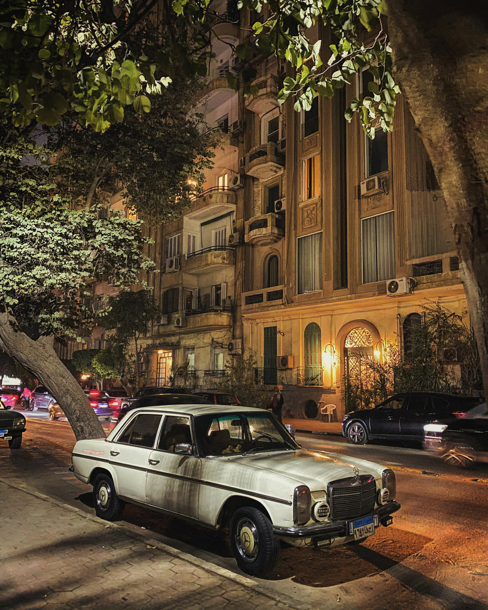 A classic Mercedes-Benz in front of an old building in Zamalek, Cairo. The scene was 